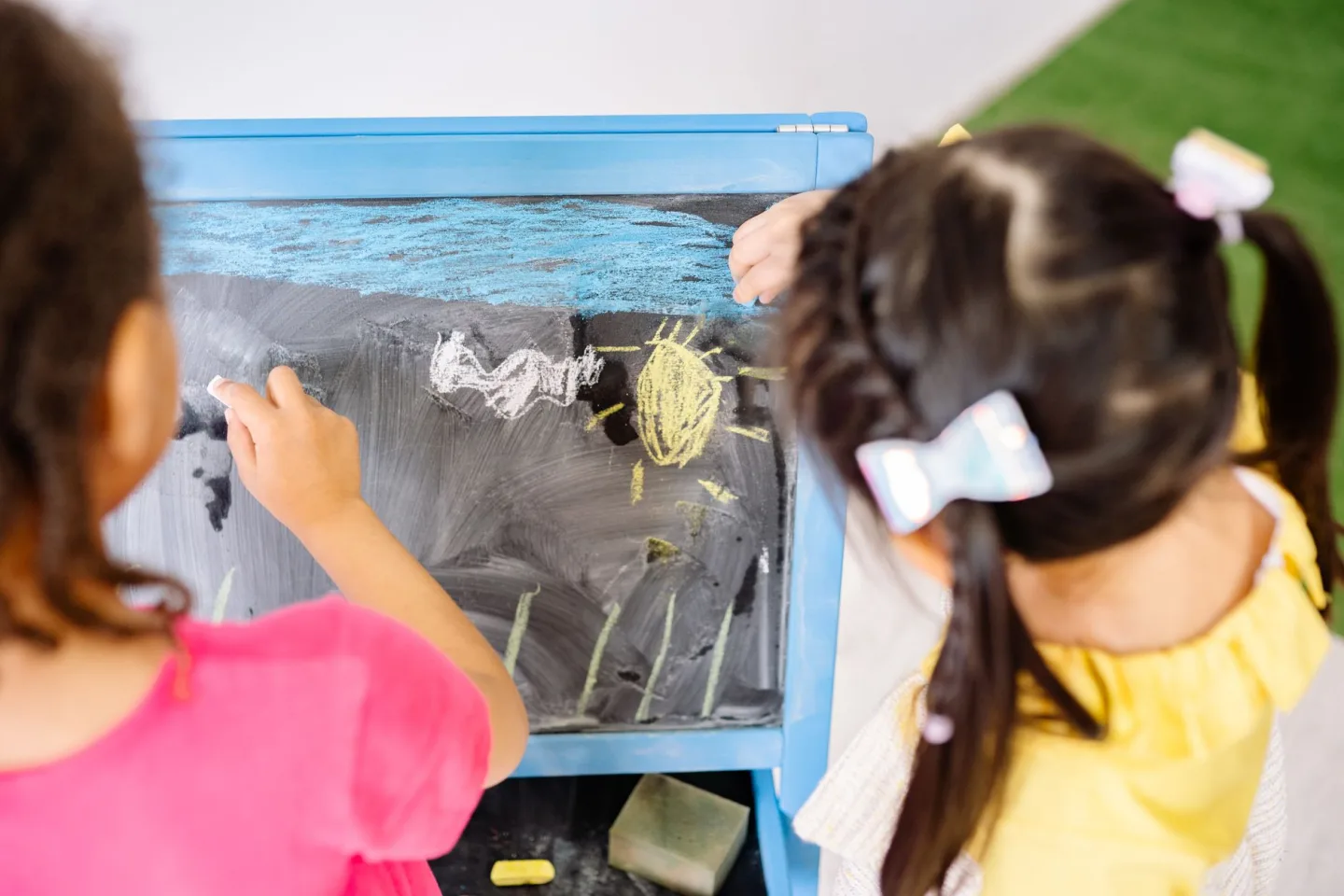 Young children playing together in a classroom
